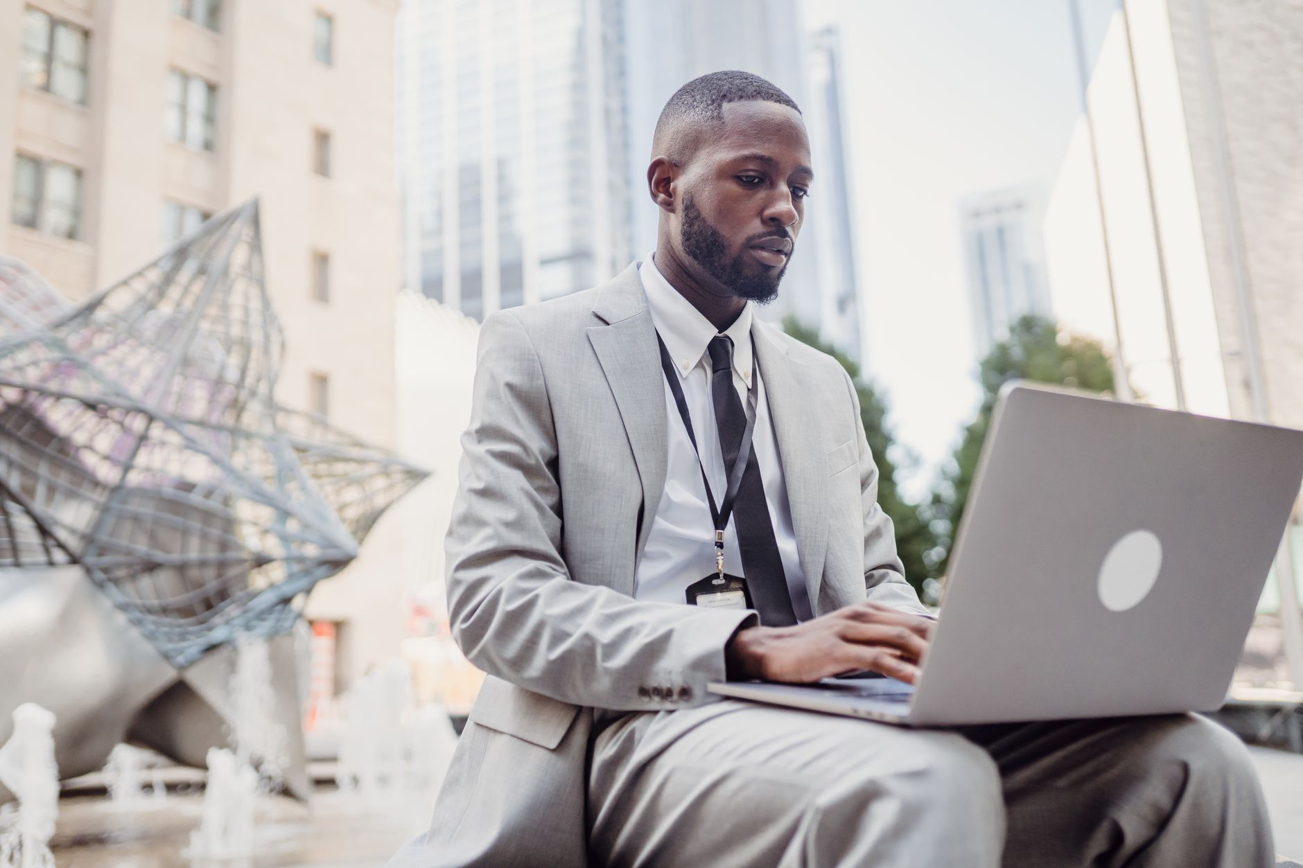 Zimbabwean businesswoman reviewing website search analytics on a laptop